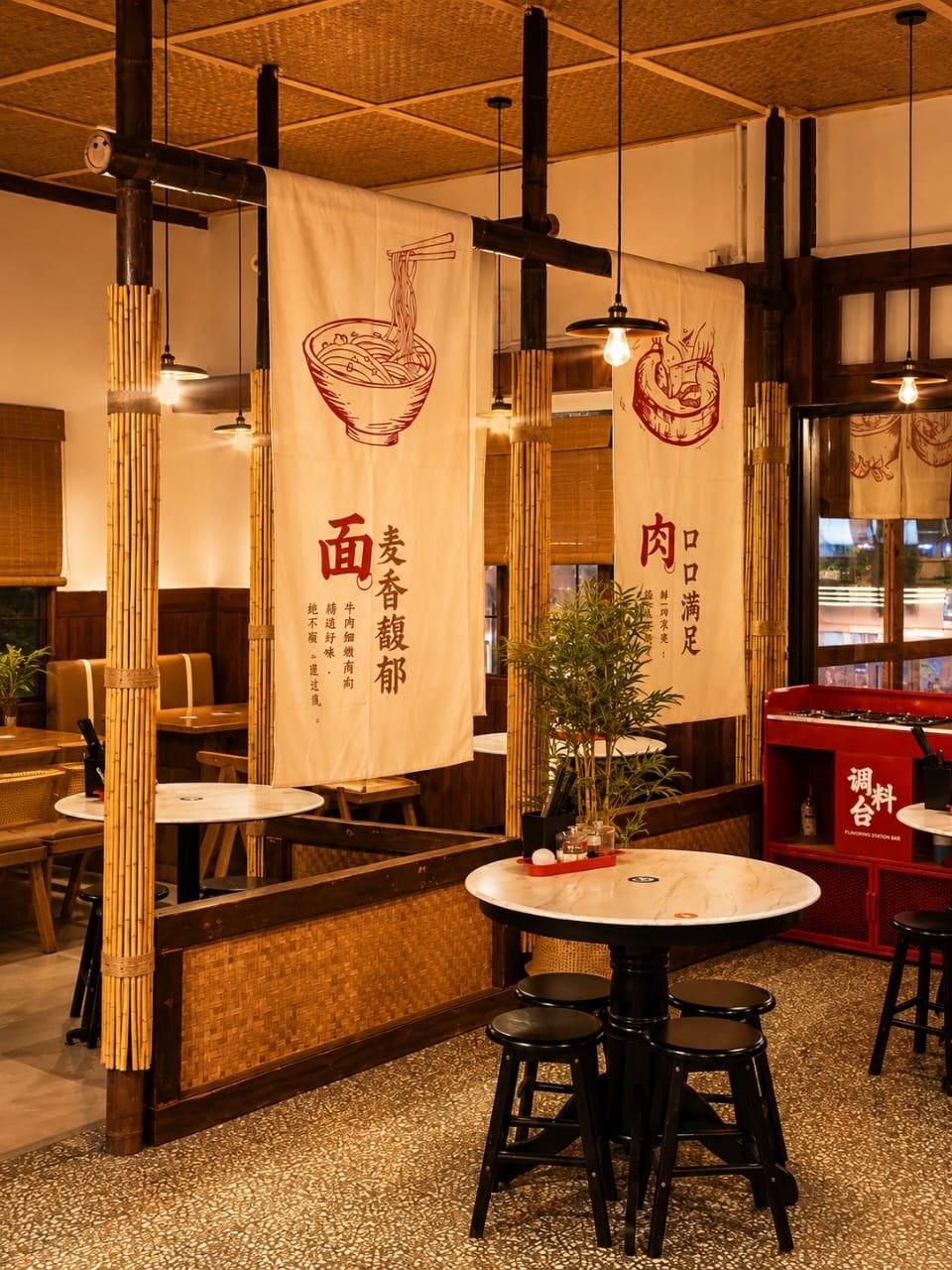 Bamboo partitions and hanging cloth banners at the Kuala Lumpur outlet