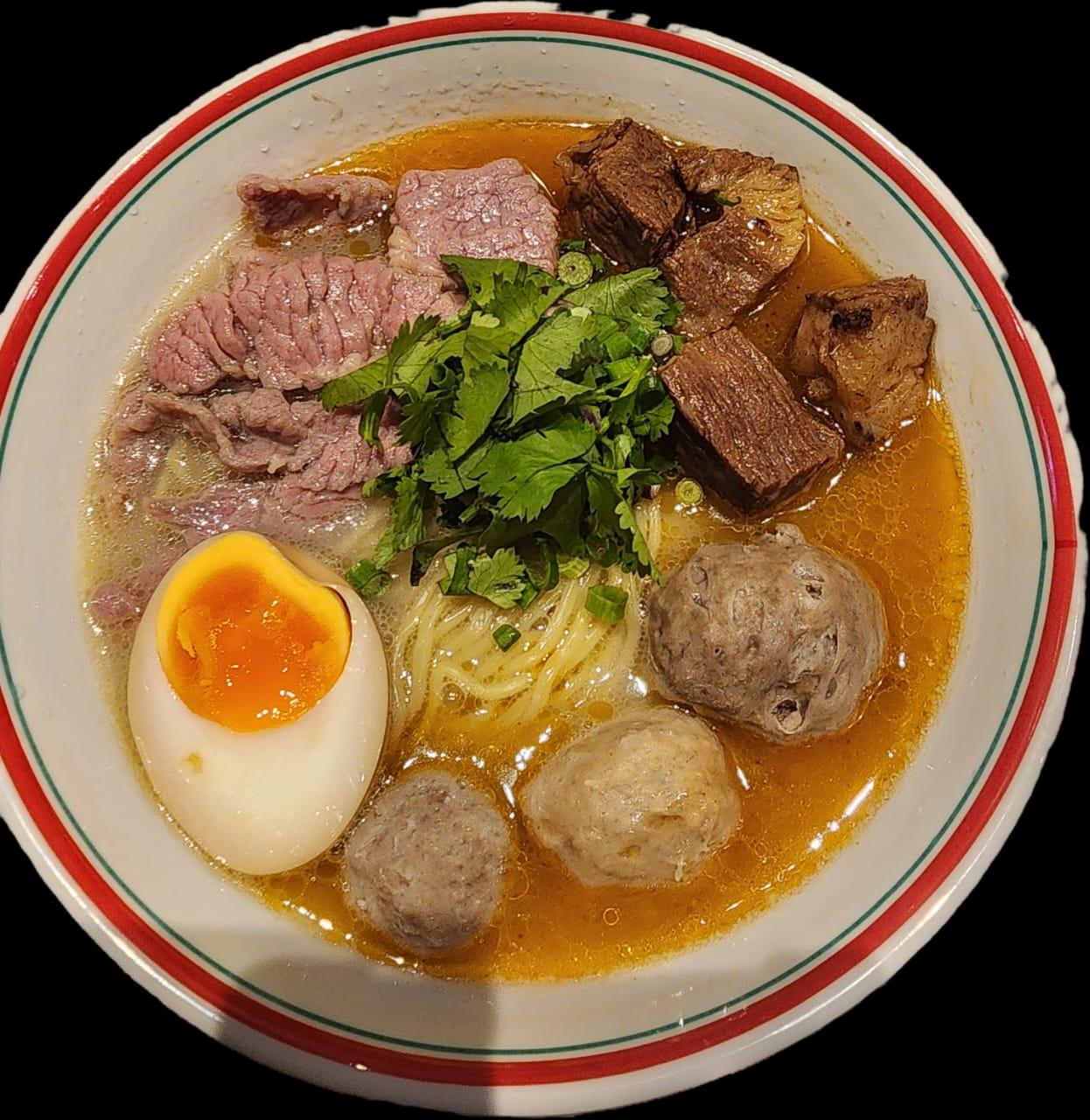 Teowkee beef noodle soup with sliced beef, meatballs, tendon and soft-boiled egg